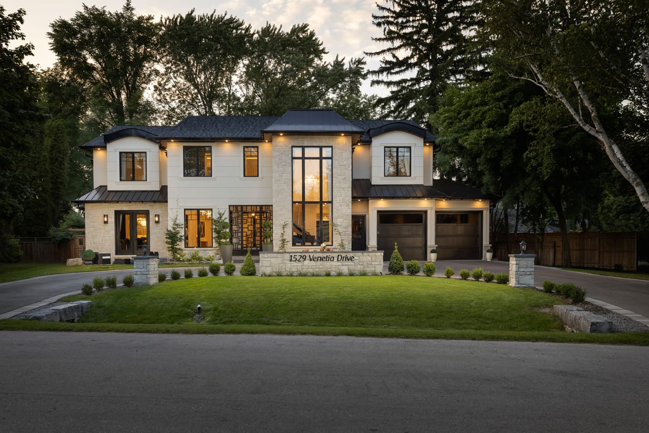Aerial view of 1529 Venetia Drive, 0.34-acre lot set back from the street with mature canopy
