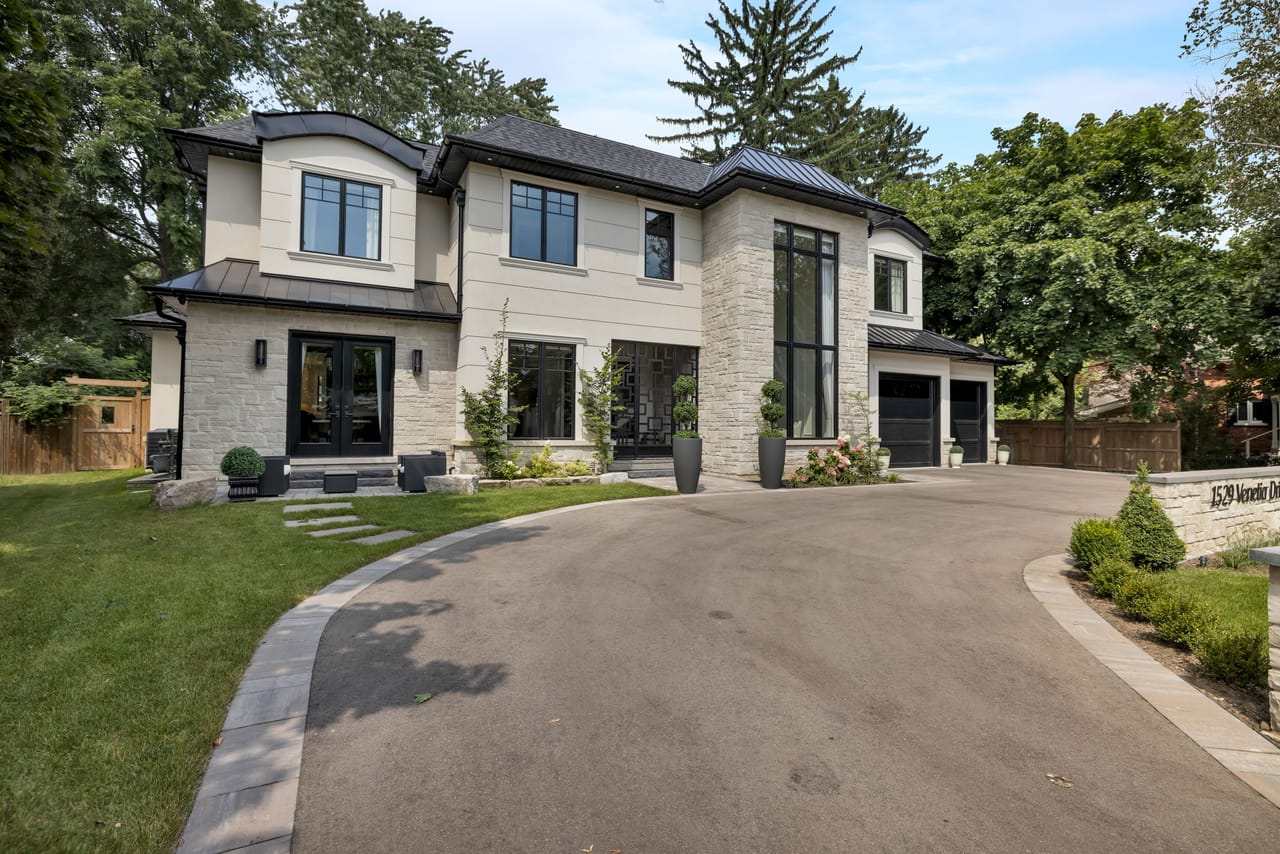 Daytime view down the driveway, showing the depth of the third-of-an-acre lot