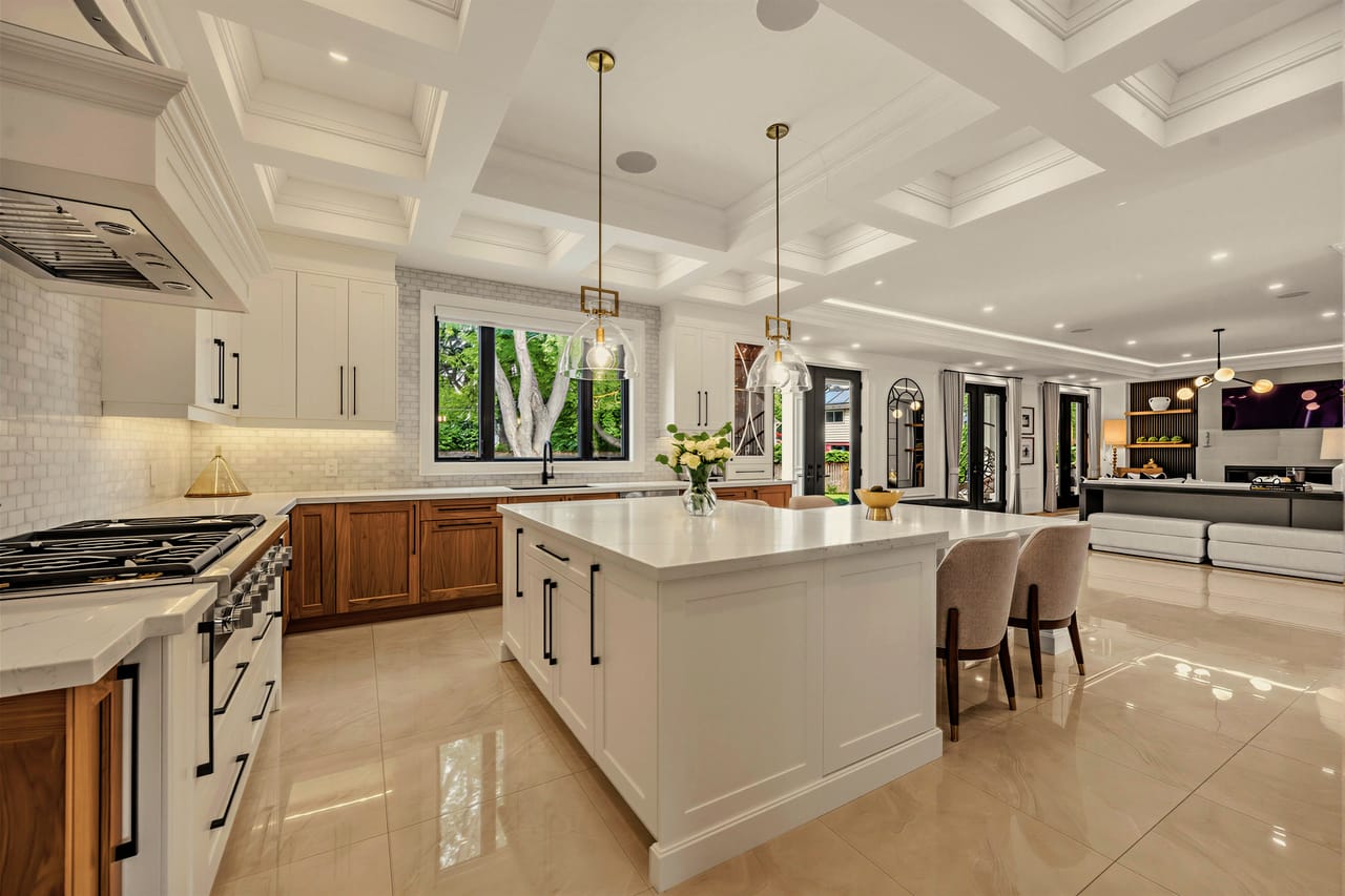 Kitchen island and professional range, with the family room beyond