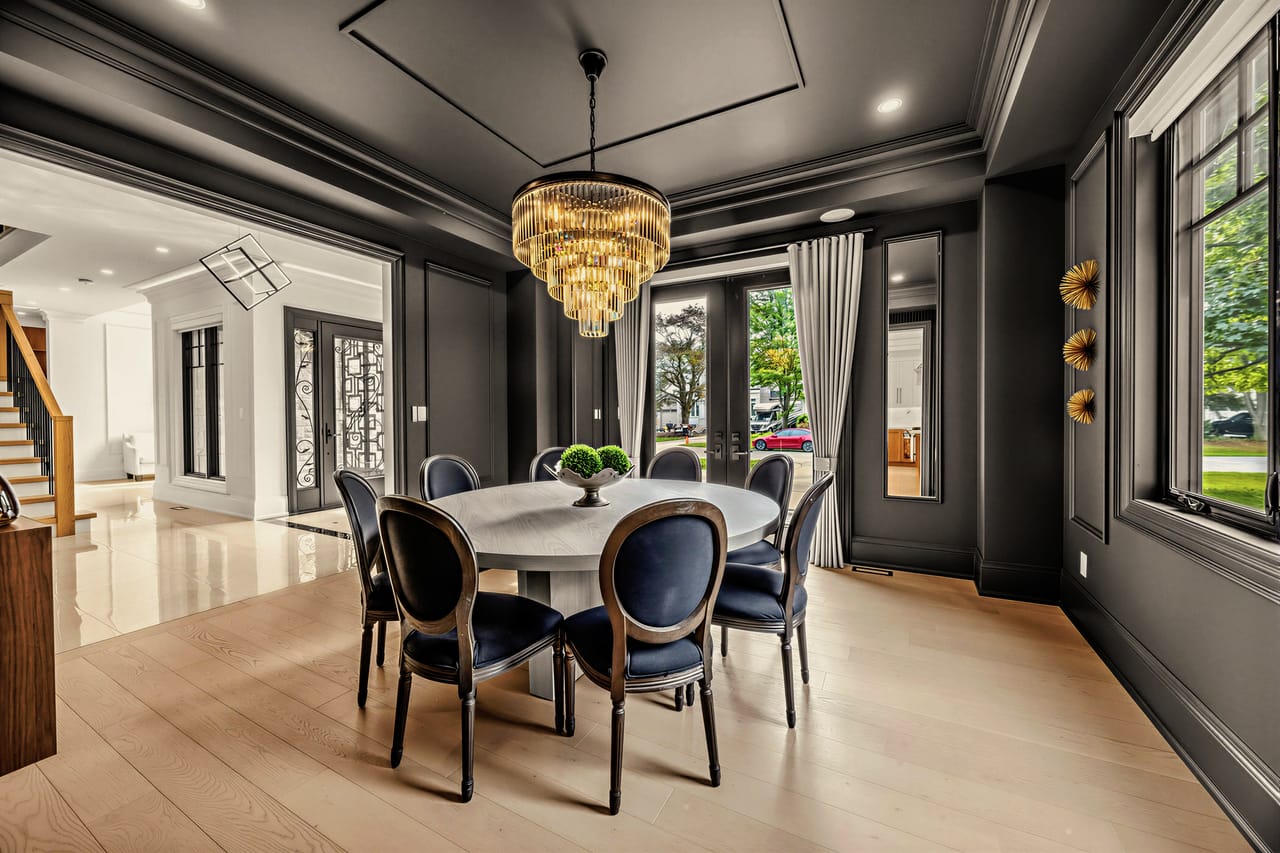 The dining room from the hall, looking through to the kitchen and front windows
