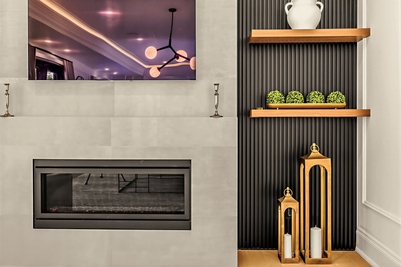 Detail of the family room fireplace and styled open shelving