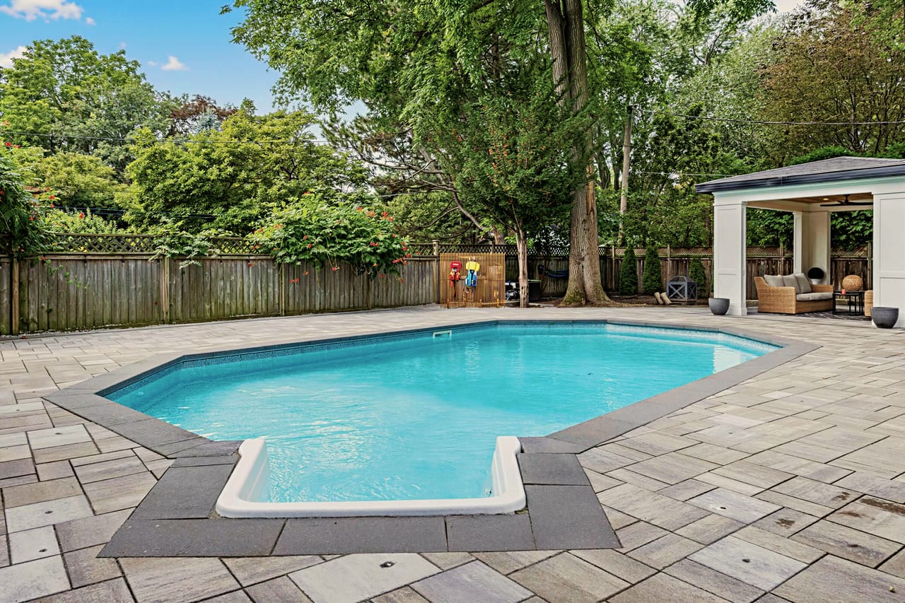 Pool and terrace looking toward the cabana and the rear fence line