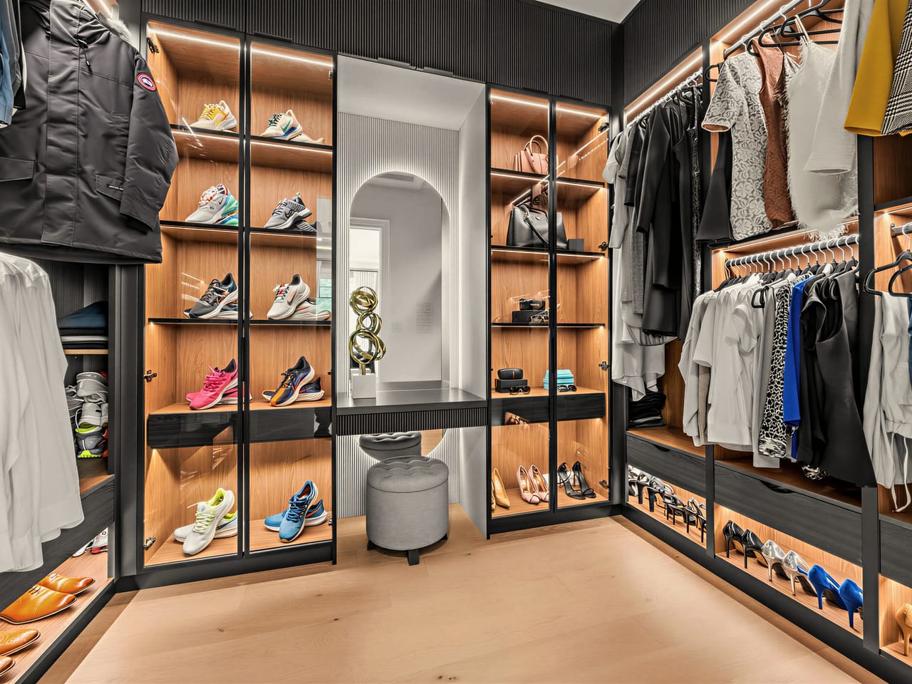 The fitted dressing room off the primary, backlit shelving on every wall