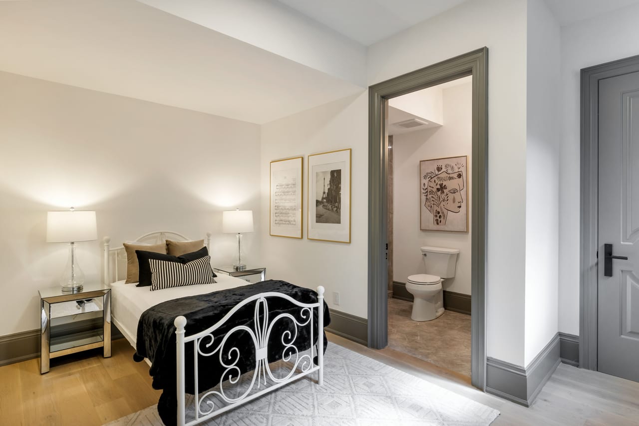 Lower-level guest bedroom with a private ensuite